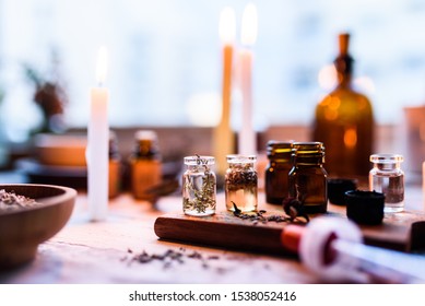 A Spread Of Jars And Apothecary Medicine Jars With Dried Herbs And Candles Used For Medicinal Purposes 