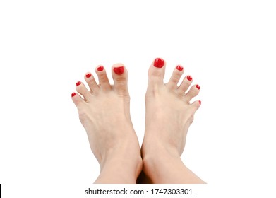 Spread Your Toes. With Painted Nails In Red. On An Isolated Background