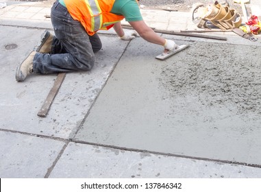 Spreading Concrete For Sidewalk Repair