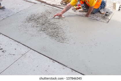 Spreading Concrete For Sidewalk Repair