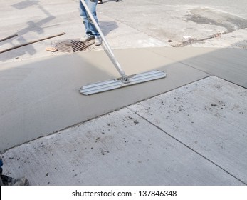 Spreading Concrete For Sidewalk Repair