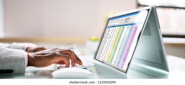 Spreadsheet Data On Laptop Computer Monitor In Office