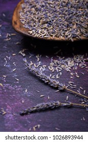 Sprigs Of Lavendar And Scattered Flowers With A Bowl Of Dried Lavender In The Background. Selective Focus. 