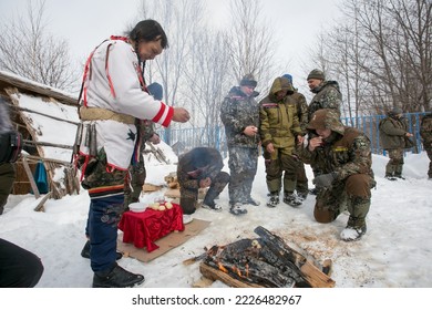 Spring, 2018 - Krasny Yar, Primorsky Region - National Udege Holiday Vakchini. The Shaman Performs The Rite Of Offering To The Spirits By The Fire.