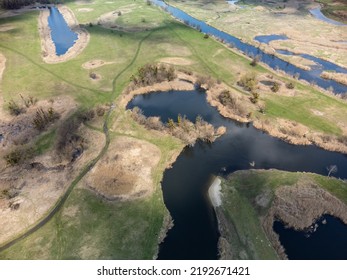 Spring Aerial Rural Look Down View On River Valley From Drone. Zmiyevsky Region On Siverskyi Donets River In Ukraine. Blue River Curve In Green Landscape