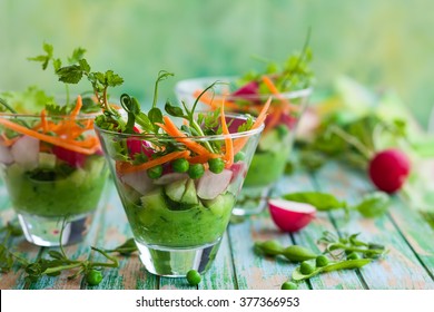 Spring appetizer with raw vegetables and green pea hummus