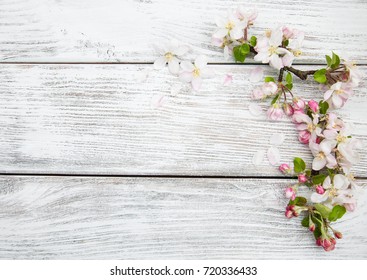 Spring apple blossom on a old wooden background