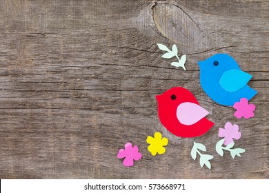 Spring Background. Two Birds And Spring Flowers On A Wooden Background. Craft For Kids. Copy Space. Children's Art Project, Needlework, Crafts For Children.