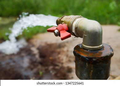 Spring, Borehole With Self-outflow. The Flow Of Groundwater. Pipe With A Crane. Water Flows By Itself. Water Extraction. A Jet Of Water Under Pressure. Pure Water. Little Brook. Groundwater Source.