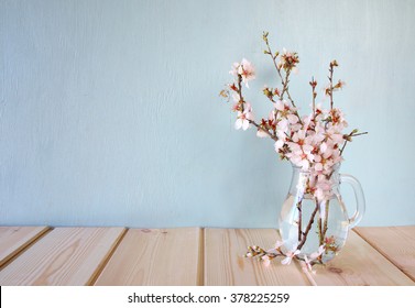 Spring Bouquet Of Flowers On The Wooden Table With Mint Background. Vintage Filtered Image
