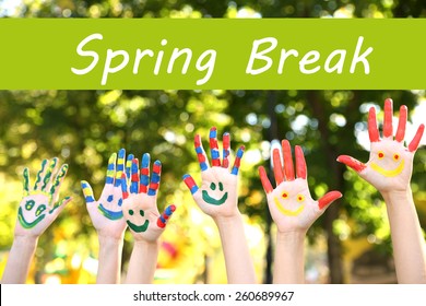 Spring Break Concept. Smiling Colorful Hands On Nature Background