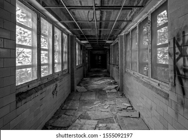 Spring City, PA / USA - August 26th, 2017 : Pennhurst Asylum abandoned hospital hallway.