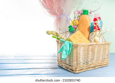 Spring Cleaning Concept. Sun Lighted Background Near Open Window With Bucket Or Basket With Cleaning Items, Bottles, Equipment, Supplies. Housecleaning, Hygiene, Chores Concept