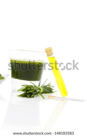Spring cleaning. Detox. pH test strips, wheat grass and green juice. Natural herbal alternative medicine. Healthy lifestyle. 