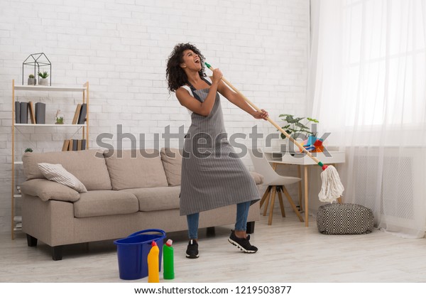 Spring Cleaning Fun Africanamerican Girl Using Stock Photo 1219503877