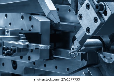 The spring coiling process using an automatic spring forming machine, a high-precision cold forming technology.