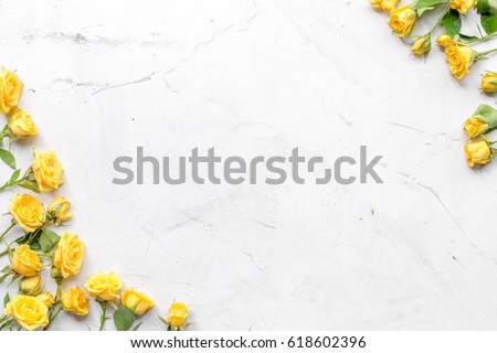 spring concept with flowers on white marble table background top view mockup