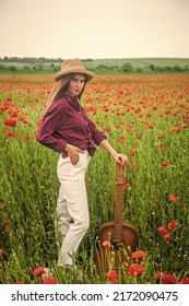 Spring Countryside. Lady Wear Checkered Shirt And Hat In Flower Field. Country Music Singer.