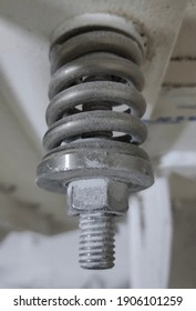 Spring design for engine restraint