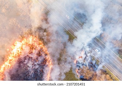 Spring Dry Grass Fire Next To A Busy Highway; Photo Taken From A Drone