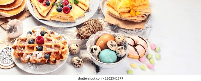 Spring Eco friendly Easter dessert table. Zero waste Easter concept Traditional natural colorful eggs. Panorama, banner - Powered by Shutterstock