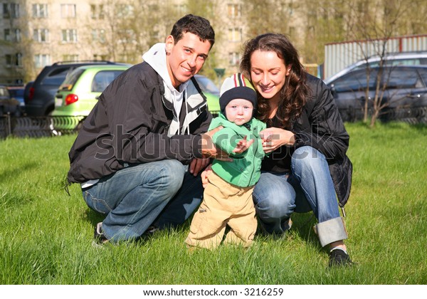 spring family with baby in\
yard