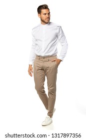 Spring Fashion Concept Studio Male Model Shooting Casual Business White Shirt Brown Chino Trousers  Outfit On White Background