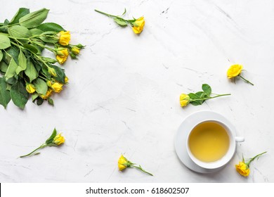 spring flatlay on white marble work desk background top view mock up