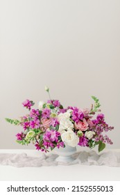 Spring Floral Centerpiece With Purple Lilacs And Pink Roses Inside