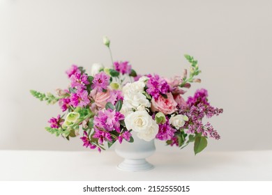 Spring Floral Centerpiece With Purple Lilacs And Pink Roses Inside