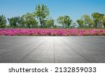 In spring, the flower beds on the side of the stone square in the park