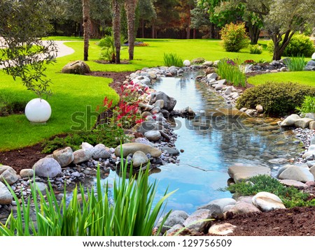 Spring flowers in the Asian garden with a pond