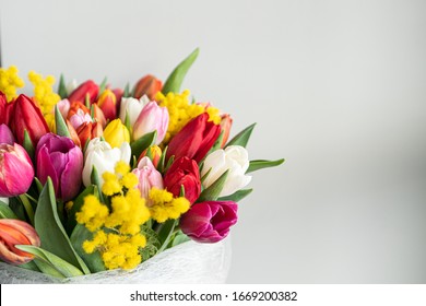 Spring Flowers Banner - Bunch Of Multi Color Tulips Flowers On White, Grey Background. Easter Day Mock Up Greeting Card. Tulip Congratulation Or Invitation Card With Free Space For Text. 