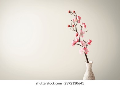 Spring flowers in glass vase still life. Blooming cherry branch on pink background. Simple minimalist home decor. Space for text - Powered by Shutterstock