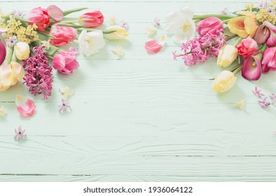 Spring Flowers On Green Wooden Background