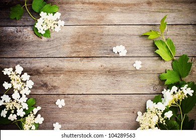 Spring Flowers On Wooden Background