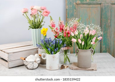 Spring flowers on wooden table. 