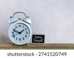 Spring Forward Daylight saving time concept with sunflowers alarm clock copy space