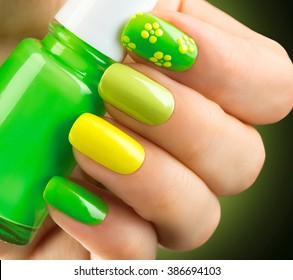 Spring Green Manicure. Fresh Nature Trendy Green Nails. Beautiful Nail Polish With Grass. Green And Yellow Colors Eco Nail Art Manicure. Bottle Of Nail Polish. Fashion Beauty Hands. Stylish Nailpolish