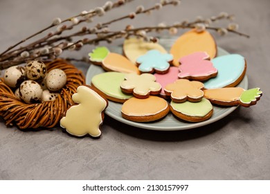 Spring Holiday Baking Concept. Compositin Of Easter Cookies On Grey Concrete Background. Colourful Sugar Cookies In Shape Of Easter Eggs, Carrots And Flowers With Decorative Icing.