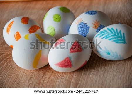 Spring holiday at Sunday. Eastertide and Eastertime. Good Friday. Hunting eggs. Painted eggs. Easter eggs on wooden table. Happy Easter holiday celebration. Easter bunny hunt. Dyed Easter eggs.