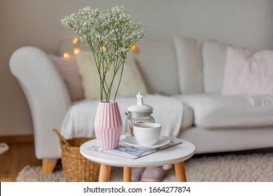 Spring Home Cozy Interior. A Bouquet Of Flowers In A Vase, A Cup Of Tea, Decor On A Coffee Table. Mood.