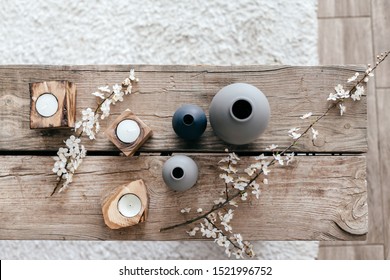 Spring home decor on reclaimed rustic bench, top view of scandinavian interior details. - Shutterstock ID 1521996752