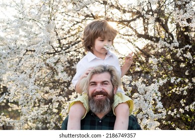 Spring Lovely Family. Father And Son. Dad Child Shoulder Ride.