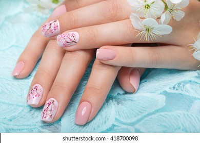 Spring Manicure For The Bride In Gentle Tones With Flowers. Nail Design. Close-up.