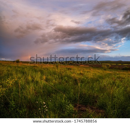 Similar – Image, Stock Photo After the rain a rainbow forms, in the foreground grasses