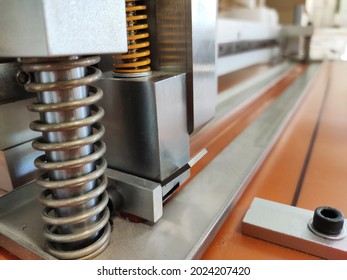 Spring Mechanism For Vibration Damping. Paper Cutter 