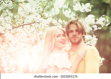 Spring, Nature, Environment. Love And Romance, Relationship, Happy Couple. Couple In Love In Blossoming Flower, Spring. Sensual Woman And Man In Cherry Bloom. Man And Woman In Spring, Easter. Family