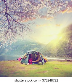 Spring At Norway Camping. Tourist Tent In The Norway Mountains At Sunrise. Vintage Colored Picture