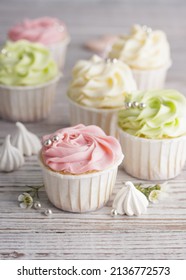 Spring Pastel Colored Cupcakes And Flowers